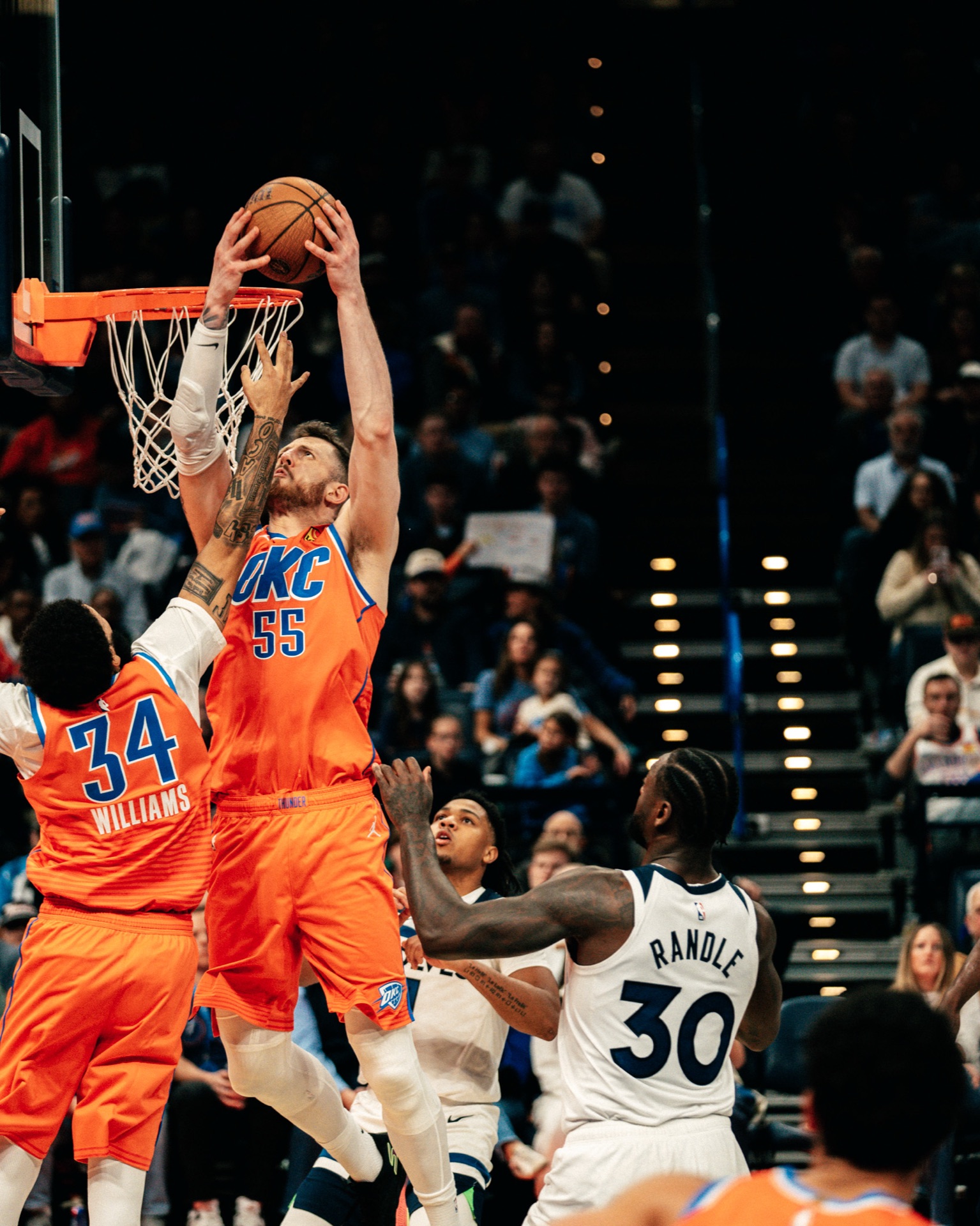 Isaiah Hartenstein rising for a two-handed putback over defenders